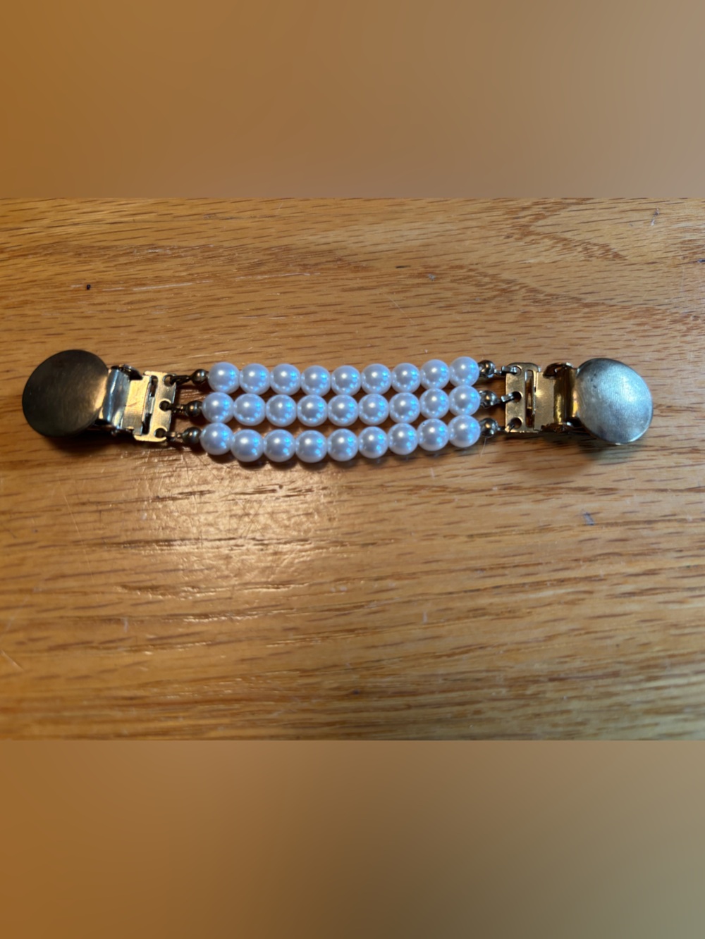 vintage triple-strand faux pearl sweater clip